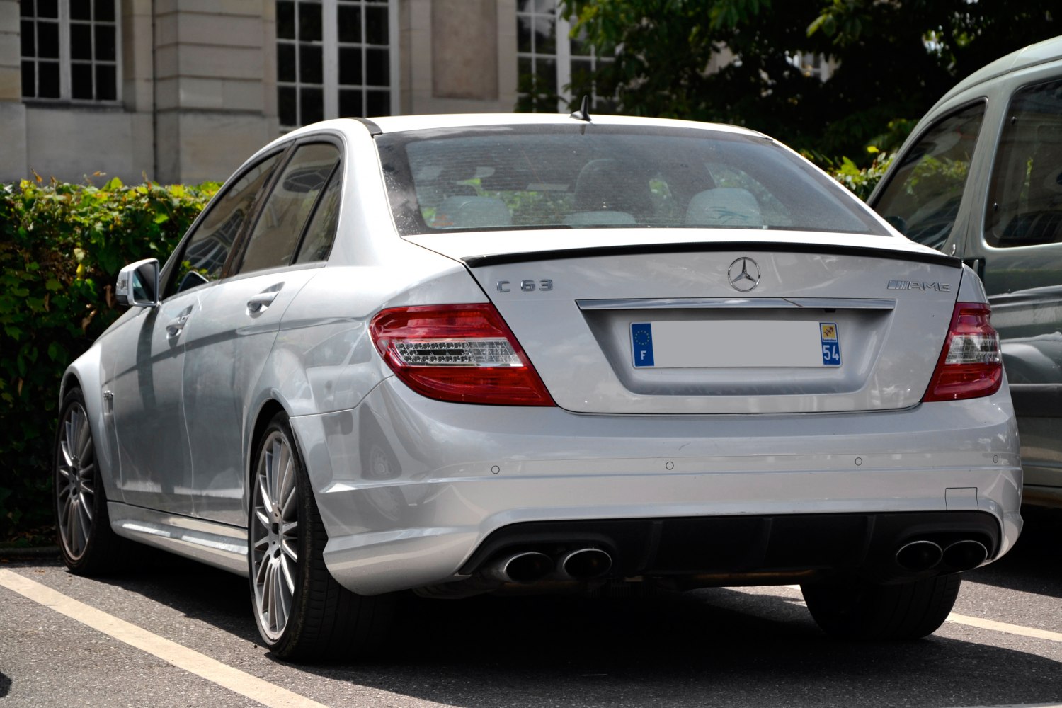 Rear view with quad exhausts and AMG badge