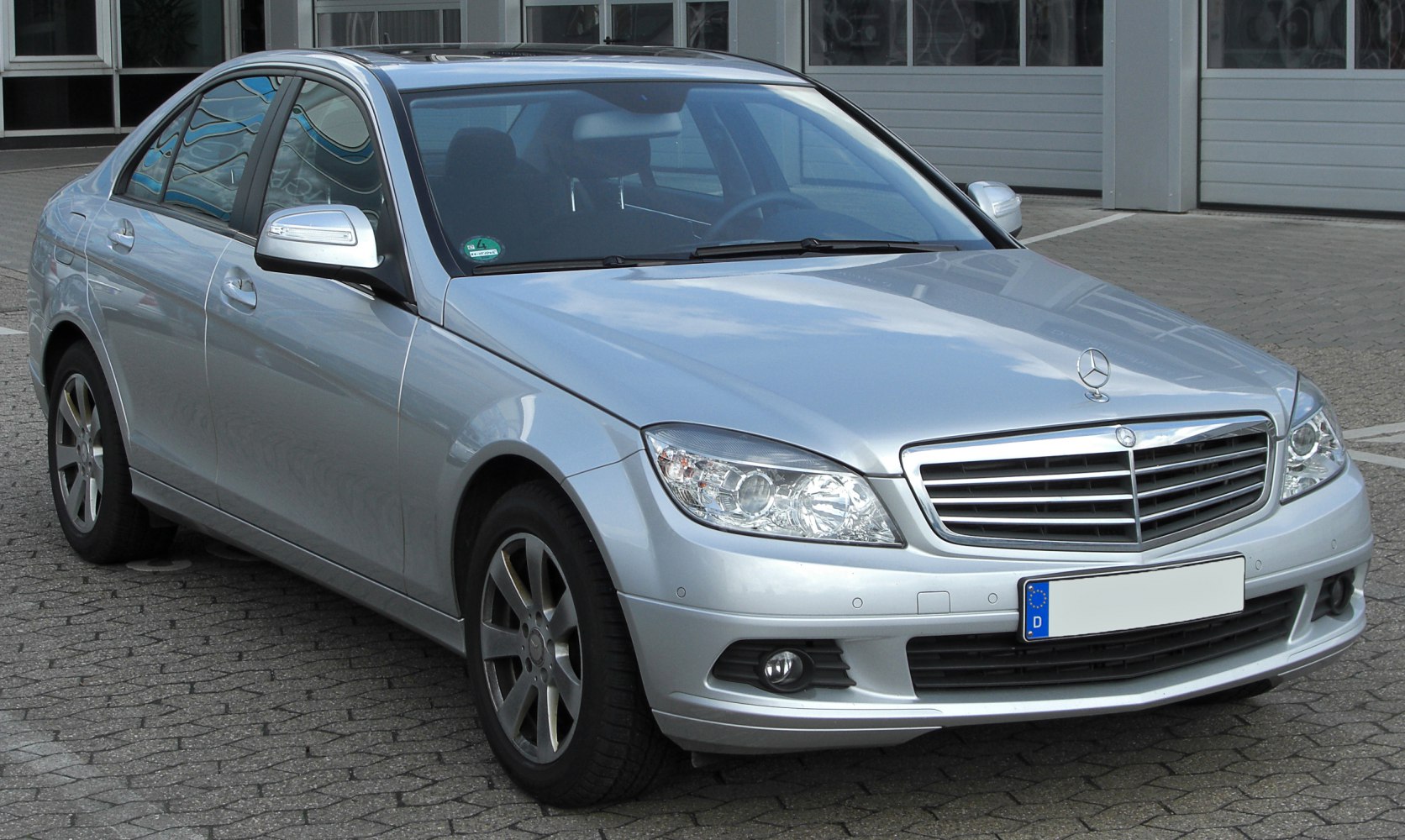 Silver sedan with front grille and headlights