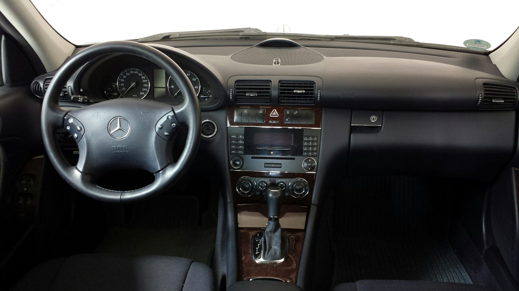 Dashboard and steering wheel with center console of a car interior