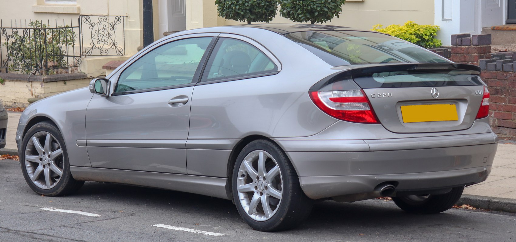 Rear side view with taillights and sporty alloy wheels