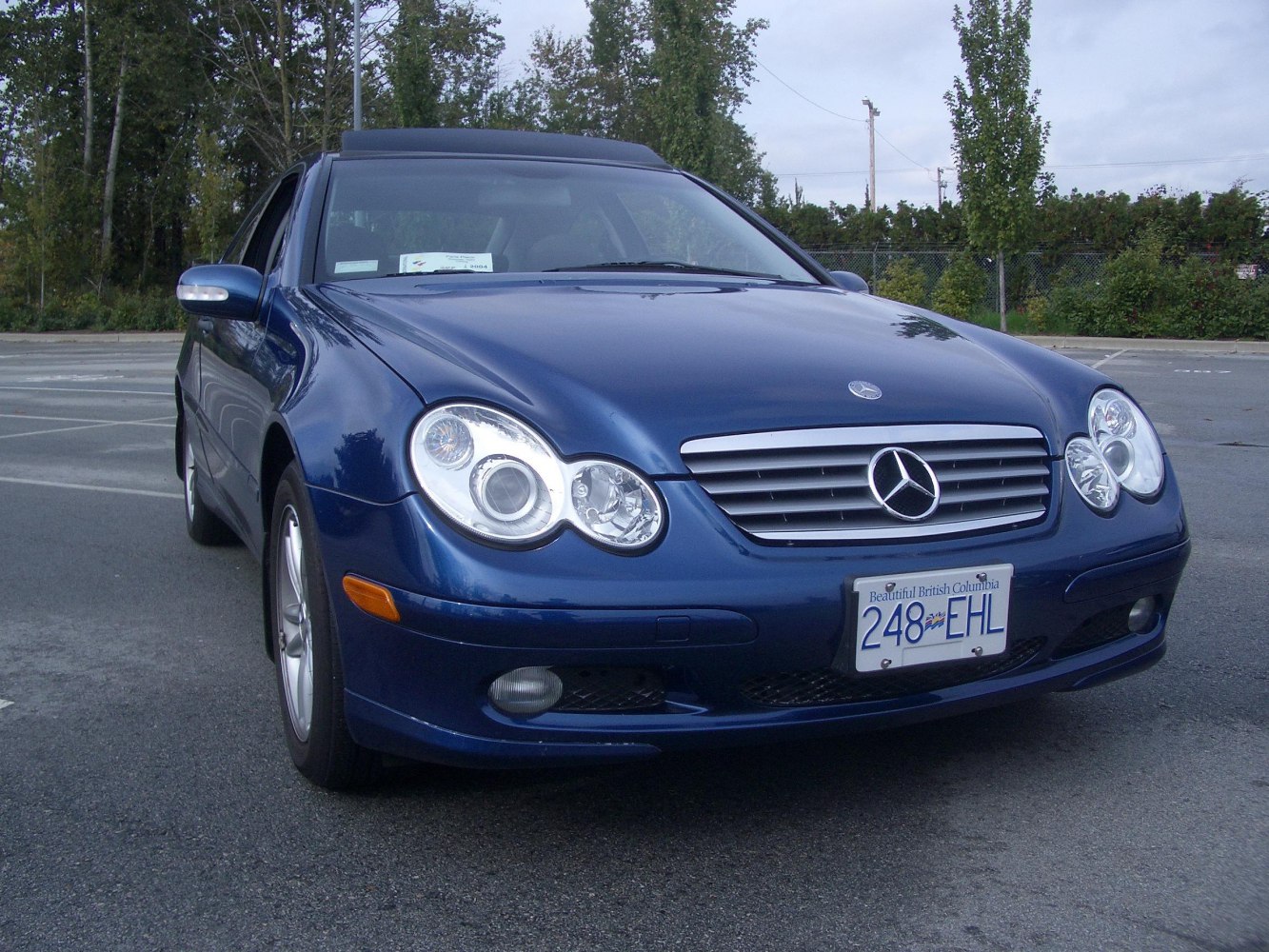 Front view with grille and dual round headlights