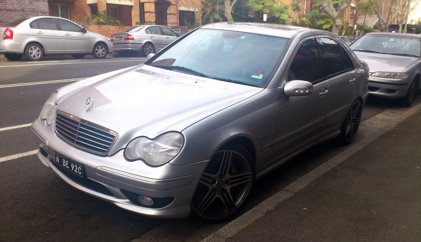 Silver sedan with rounded headlights and sporty alloy wheels