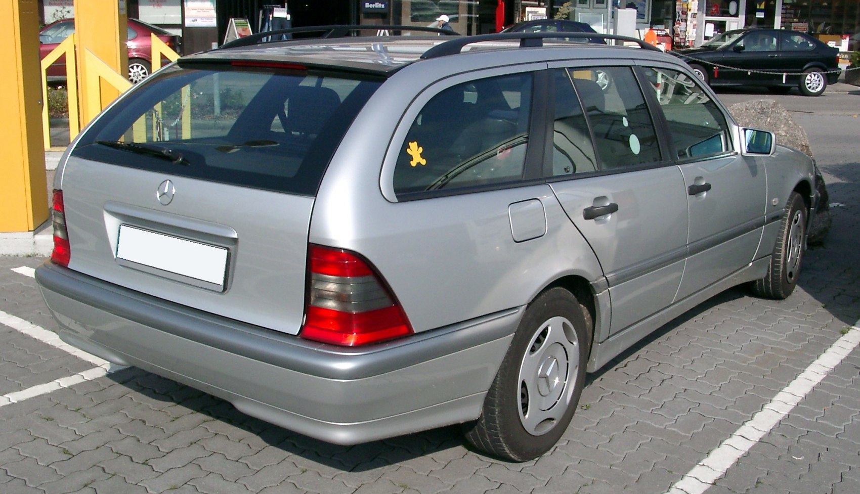 Silver T-modell station wagon rear view with taillights and rear window