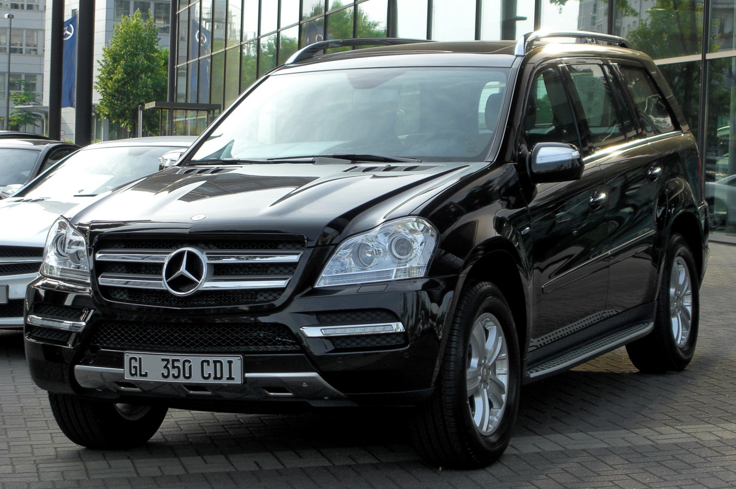 Black luxury SUV with prominent front grille and headlights