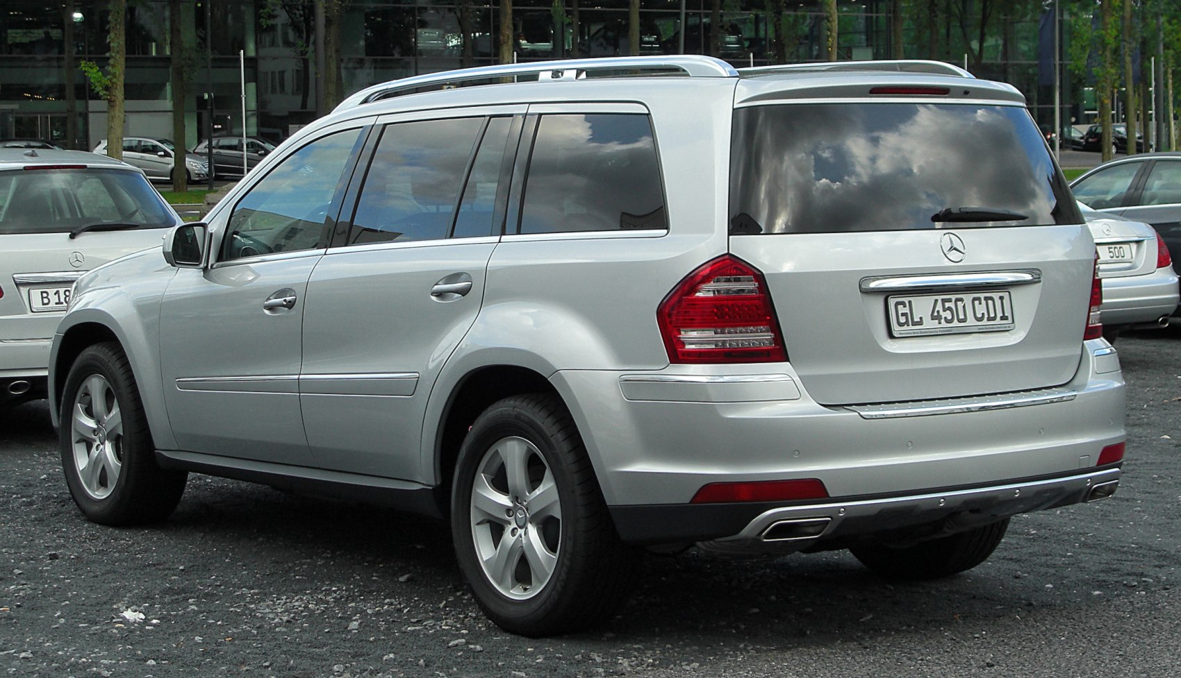 Silver SUV with tinted windows and dual exhaust design