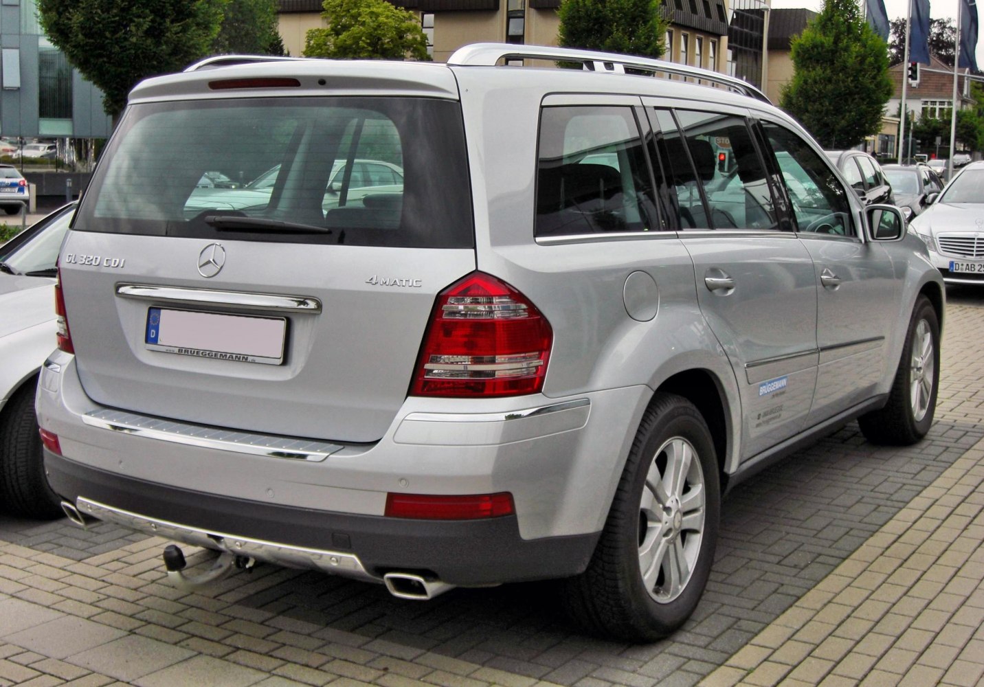 Rear view of an SUV with 4MATIC badge and tow hitch
