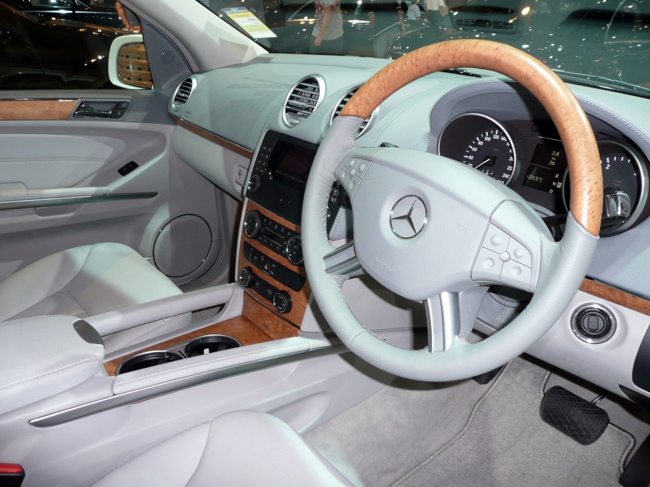 Luxury interior with wood trim steering wheel and dashboard