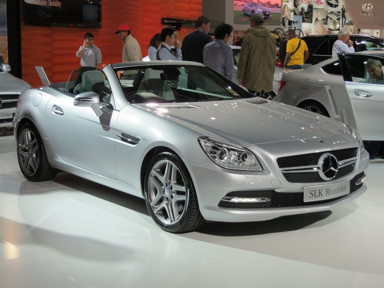 Silver convertible roadster with sporty alloy wheels and open roof