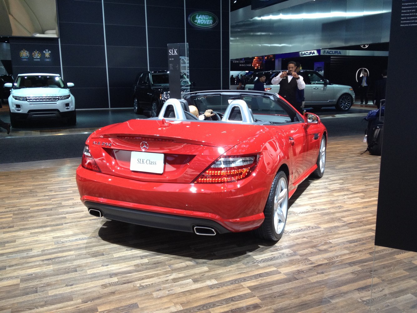 Red convertible rear with dual silver roll bars and LED taillights