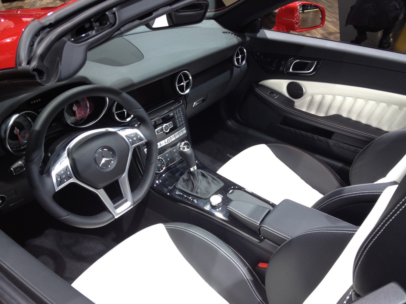 Luxury sport convertible interior with advanced dashboard and dual-tone seats