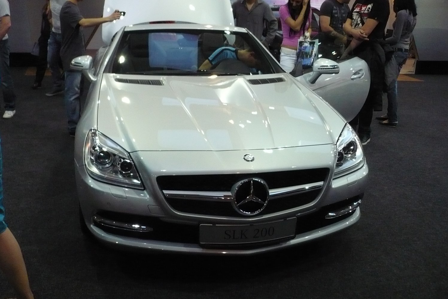Front view showing grille, headlights, and hood design