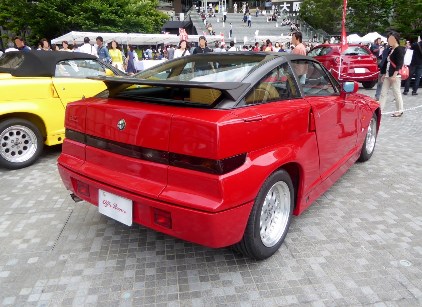 Red sports coupe with angular rear design and prominent spoiler