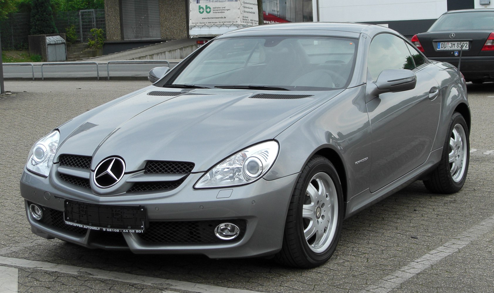 Front view with sleek headlights, grille, alloy wheels