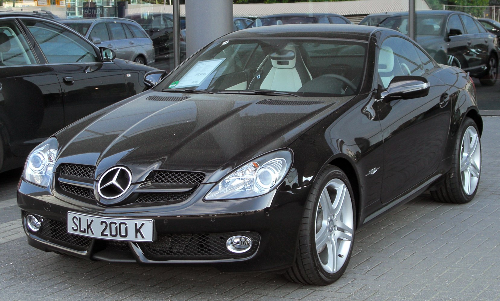 Front view with headlights and alloy wheels of a sporty coupe