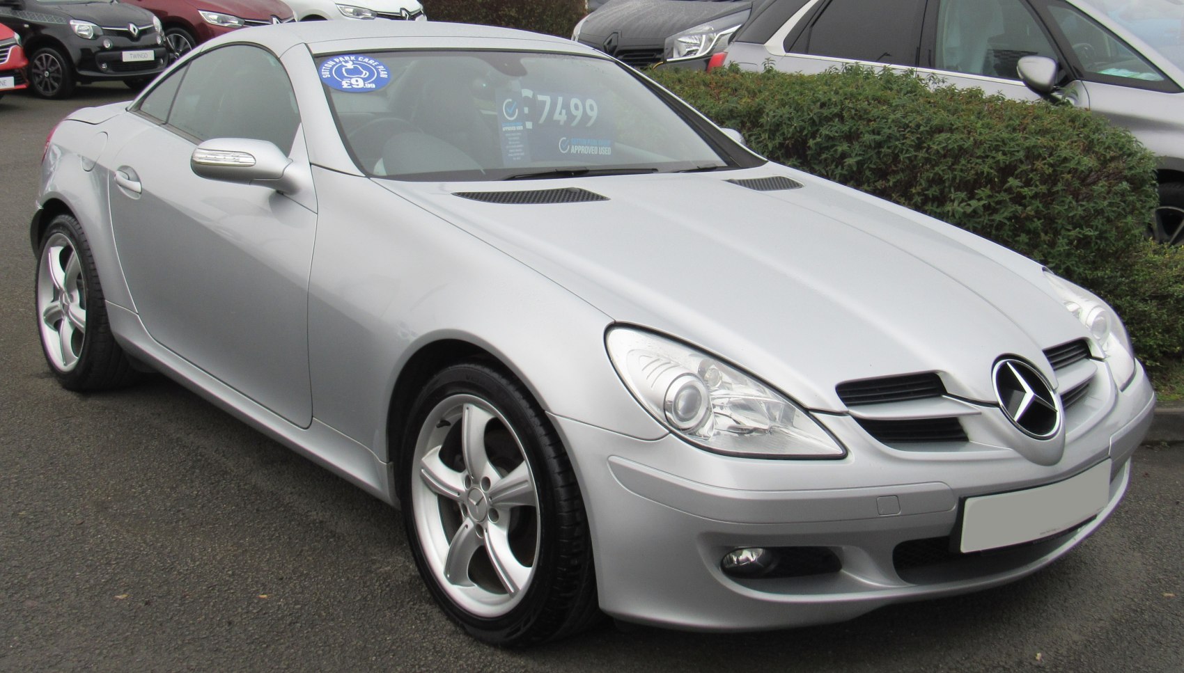 Silver coupe with sporty front grille and alloy wheels
