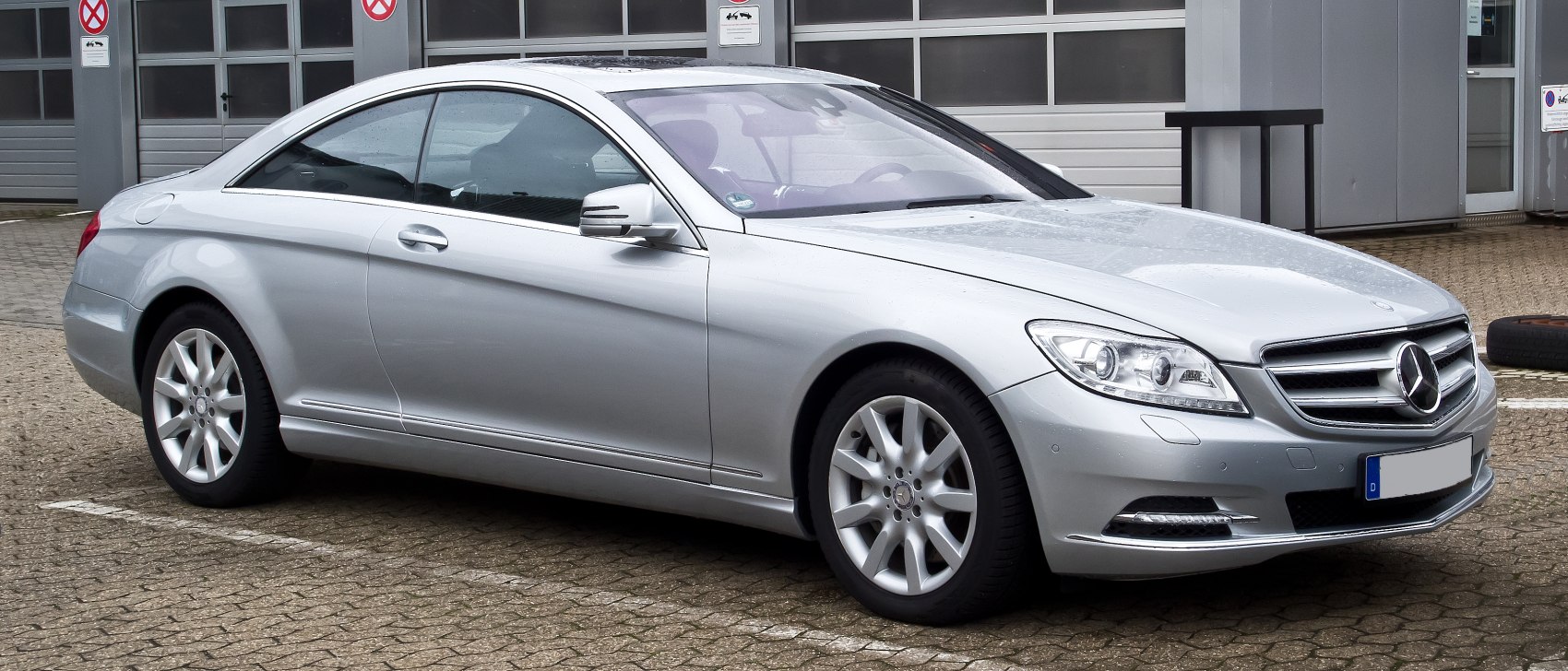 Silver luxury coupe with sleek profile and refined front design