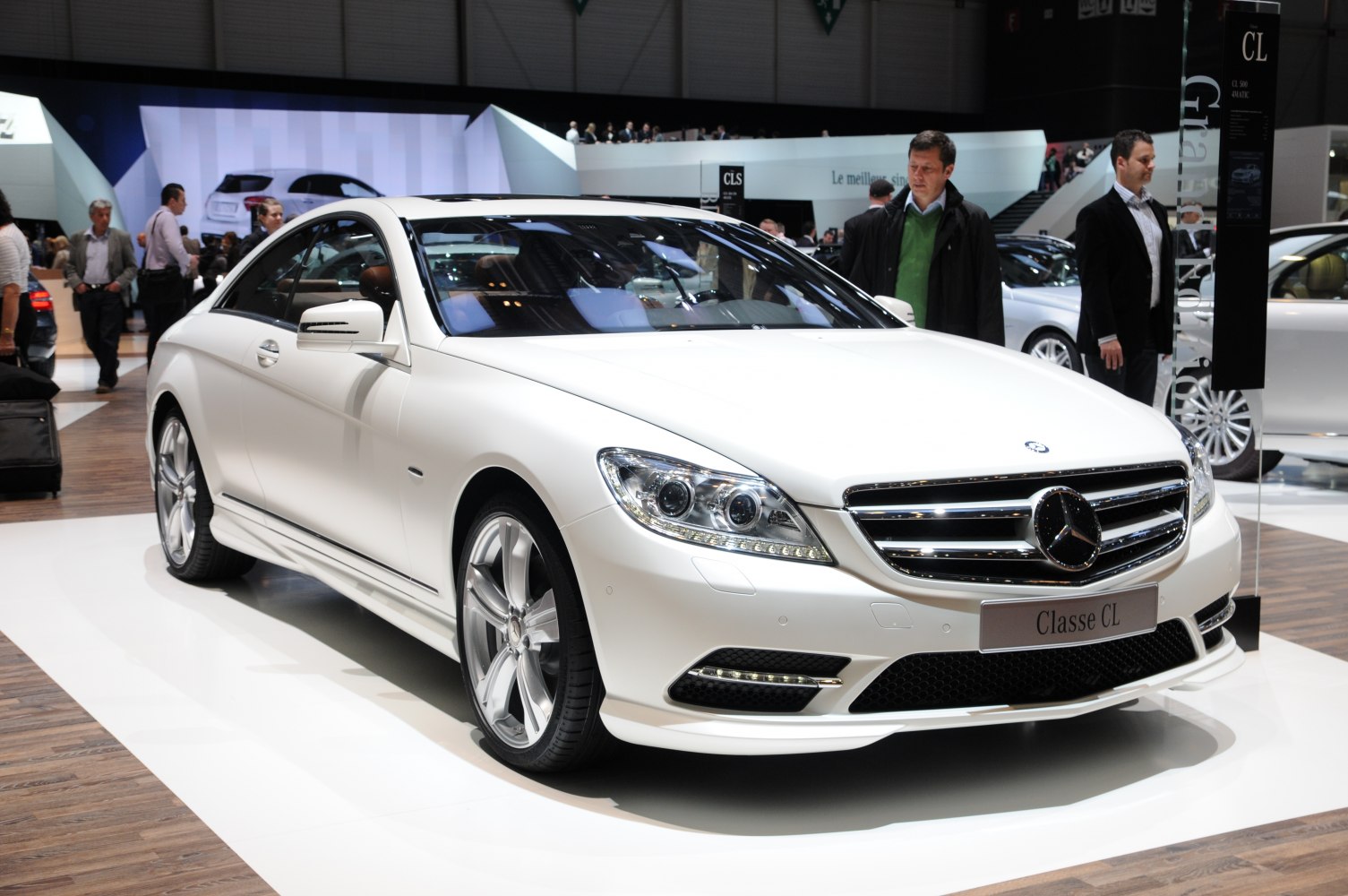 Front angle view with LED headlights and chrome grille of a luxury coupe