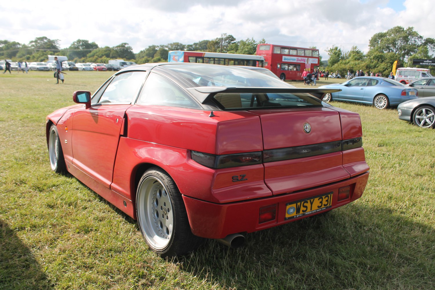 Rear view of a sports coupe with angular design and distinctive spoiler.