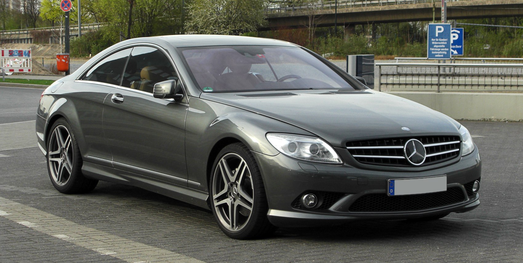 Luxury coupe front side view with sporty alloy wheels