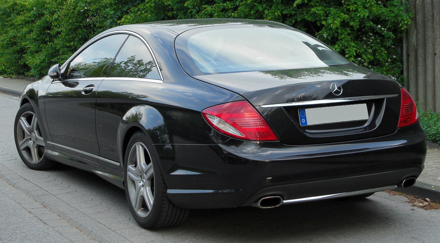 Luxury coupe rear with dual exhaust and tinted windows