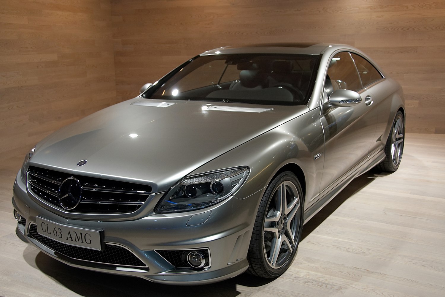 Front view of a luxury coupe with AMG grille and headlights