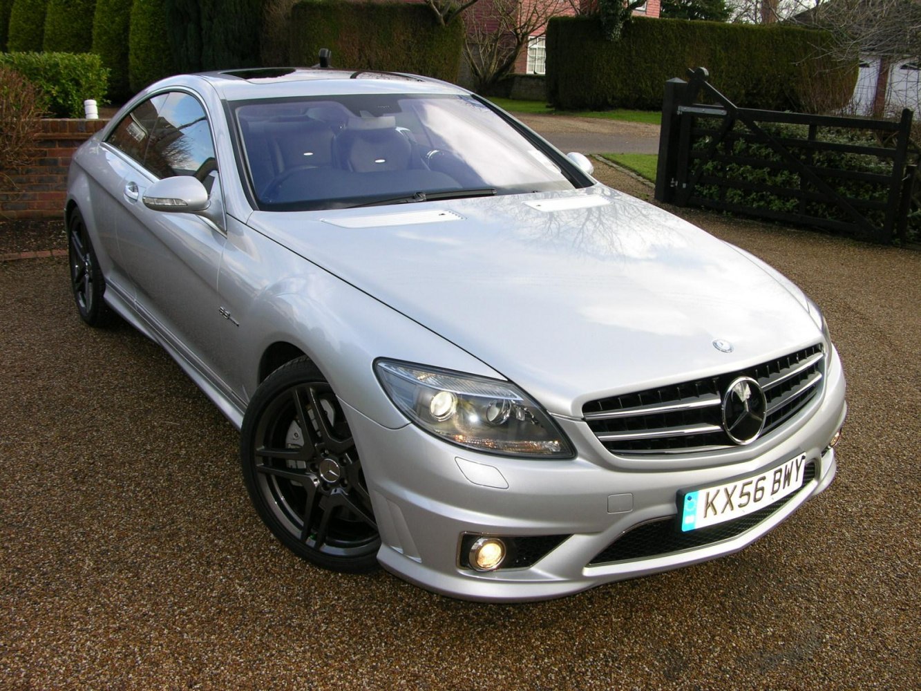 Silver coupe with front grille and black alloy wheels
