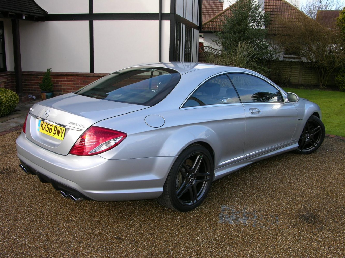 Silver coupe with black alloy wheels and quad exhaust tips