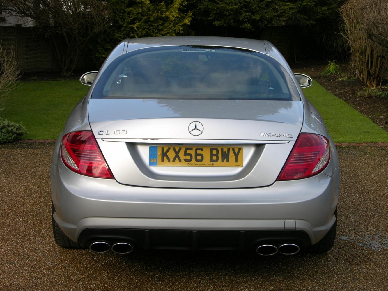 Rear view with quad exhausts and distinctive taillights