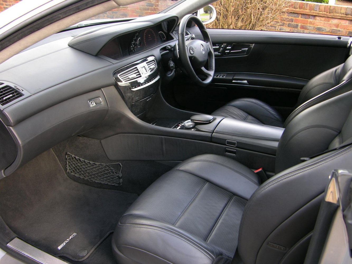 Luxury black leather seats and dashboard with advanced controls