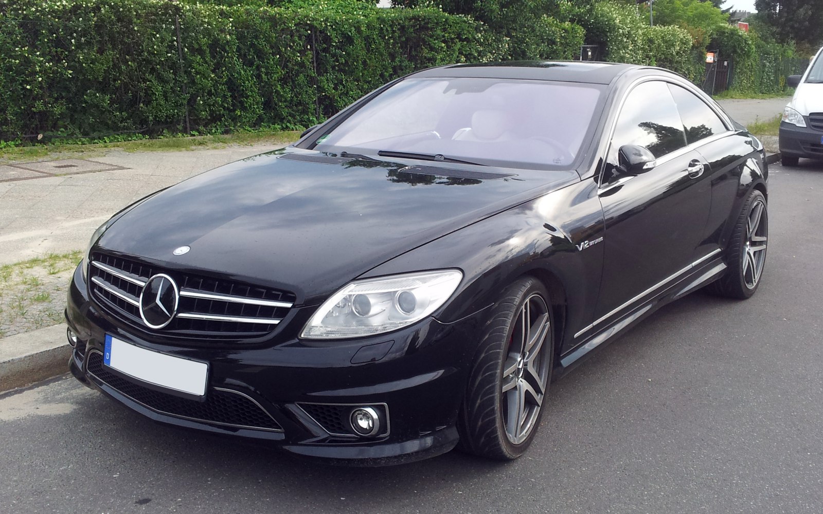 Luxury coupe with aggressive front fascia and V12 AMG badging