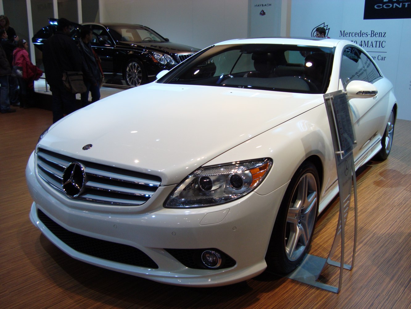 Luxury coupe front view with prominent grille and headlamps