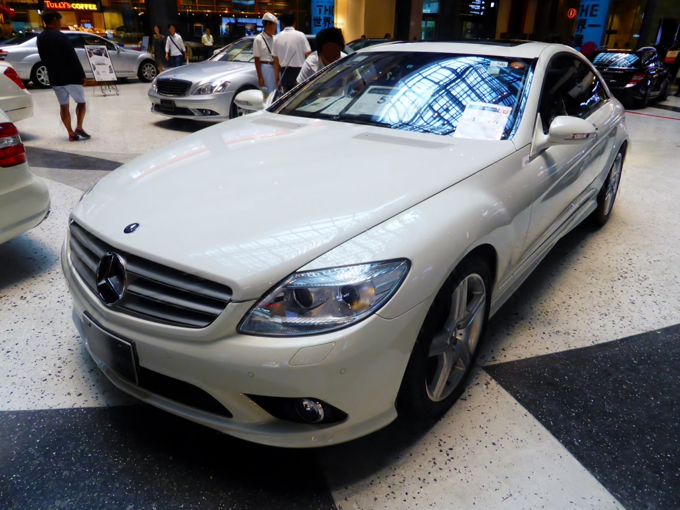 Front grille and sleek headlights of a luxury coupe