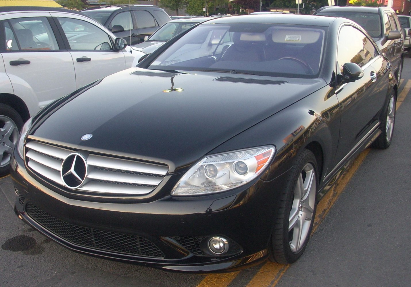 Front view of a luxury coupe with distinctive headlights and bold grille