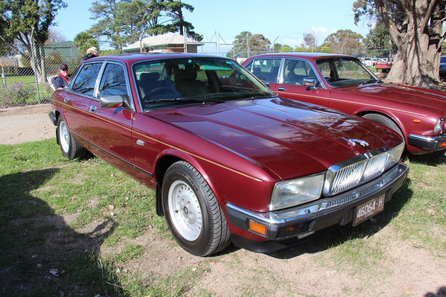 Classic luxury sedan front with distinct chrome grille and angular headlights