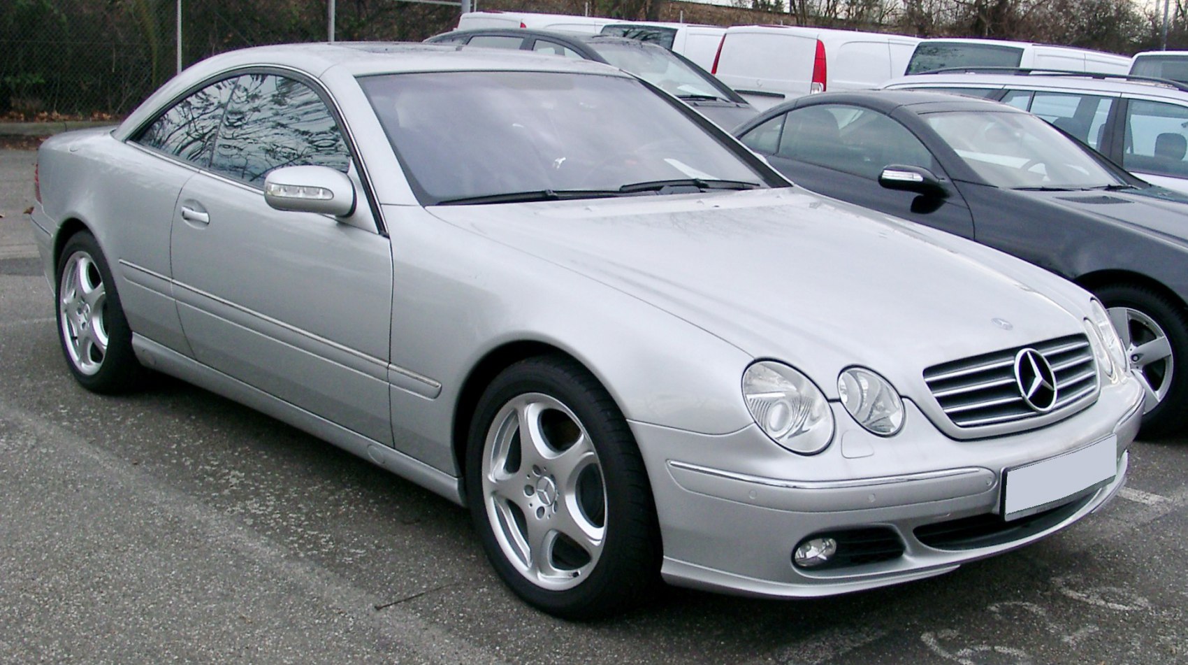 Silver coupe with oval headlights and Mercedes grille