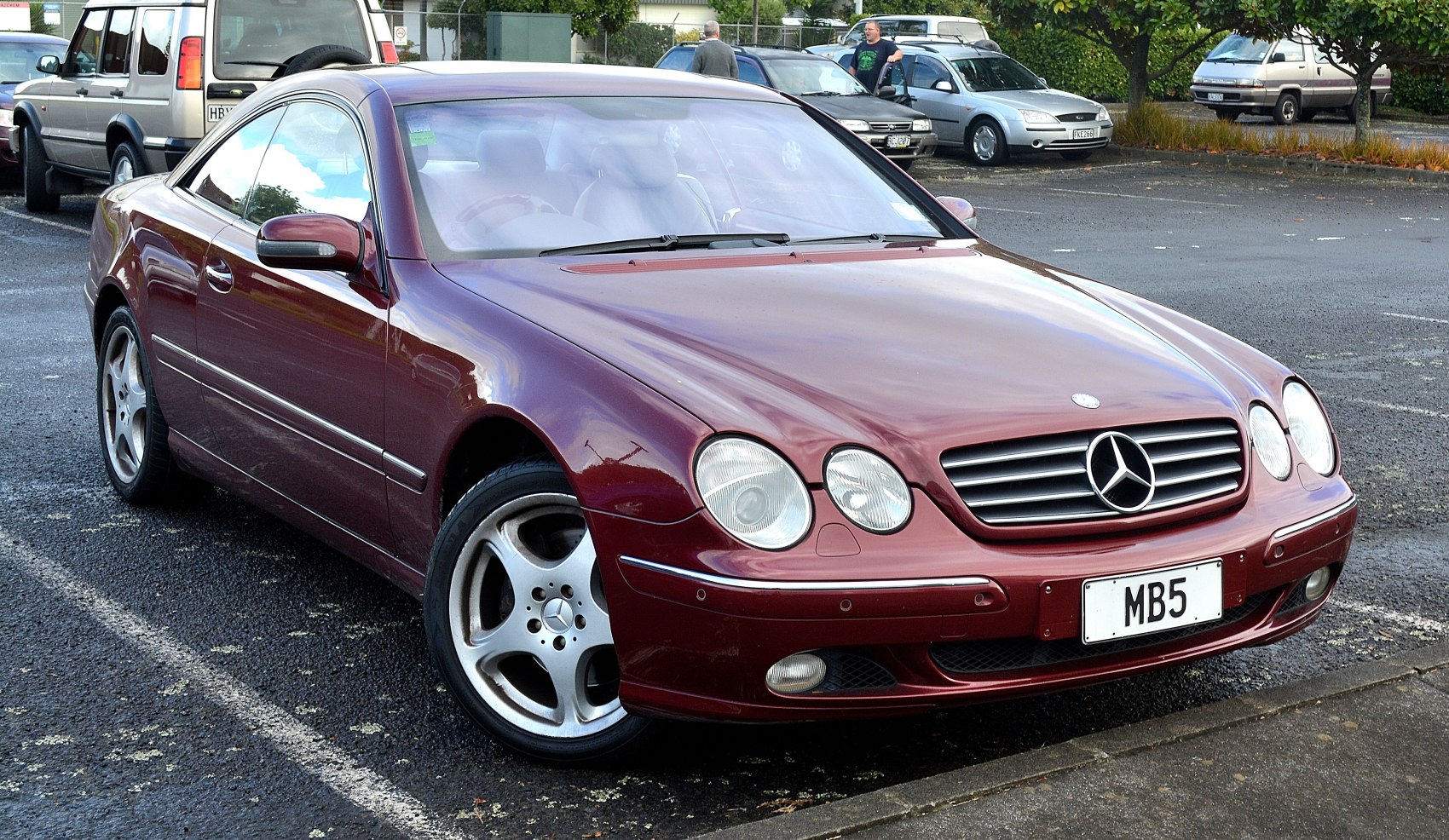 Sleek luxury coupe with quad headlights and alloy wheels