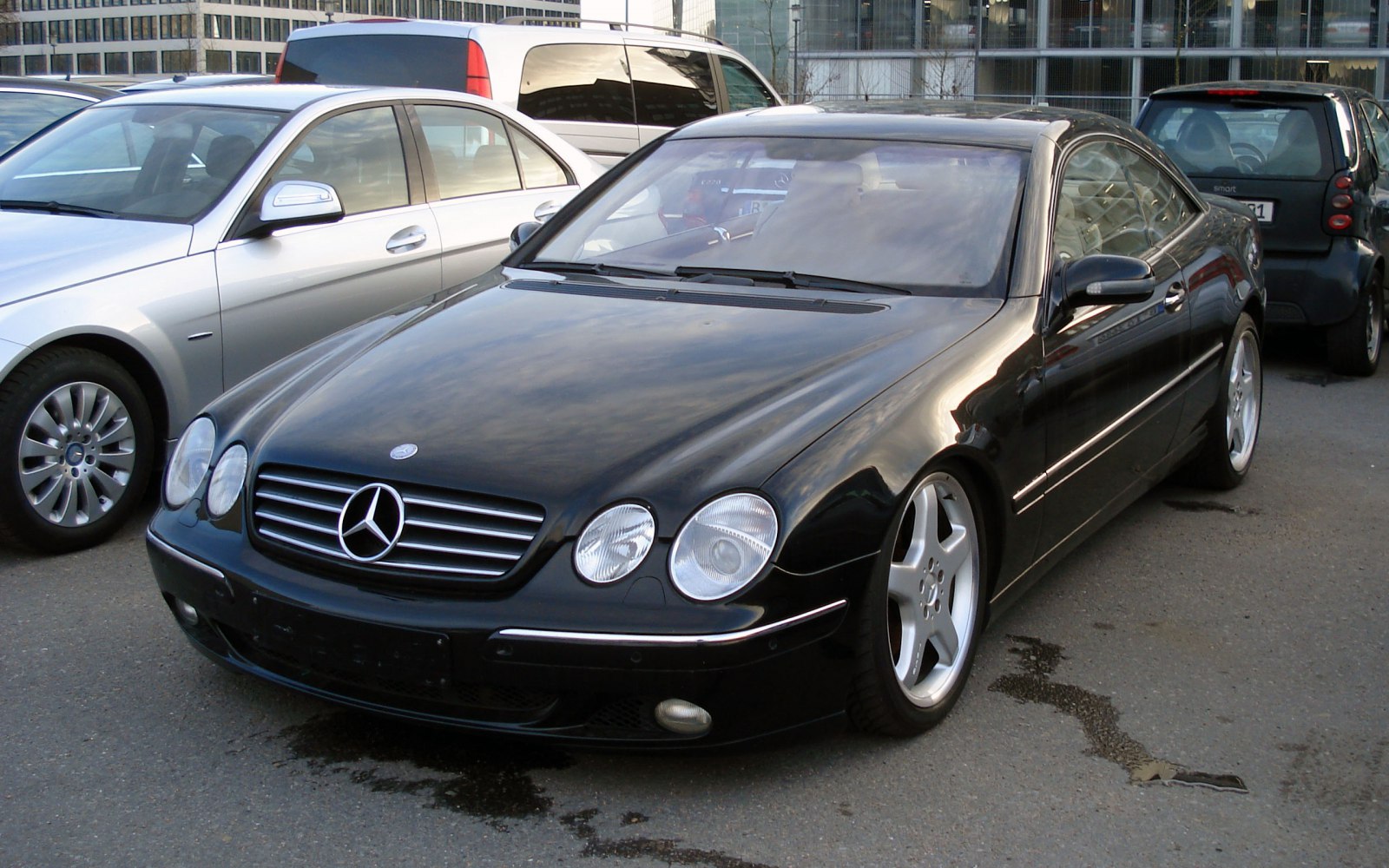 Luxury coupe with dual round headlights and AMG alloy wheels