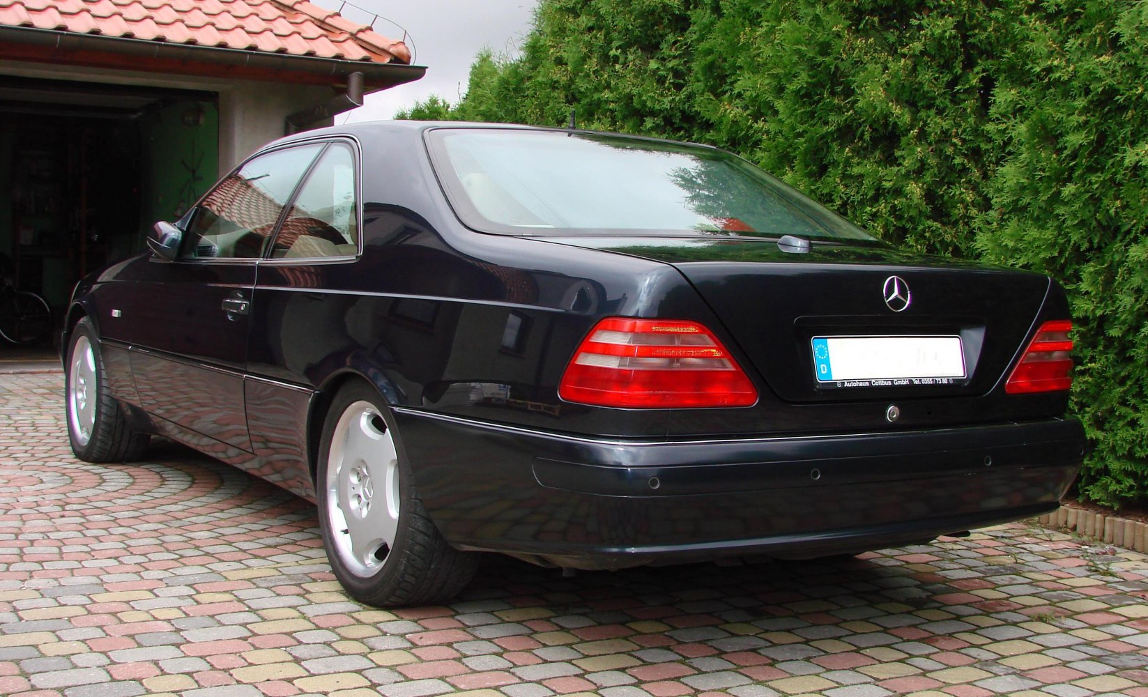 Rear and side profile with distinctive taillights and coupe shape