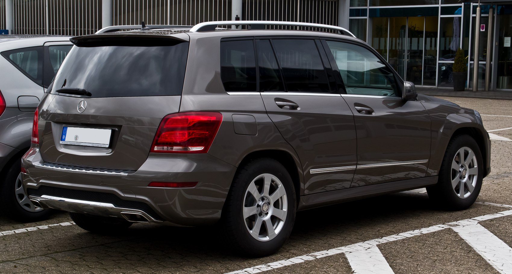 Rear and side view of a luxury SUV with distinctive tail lights and alloy wheels