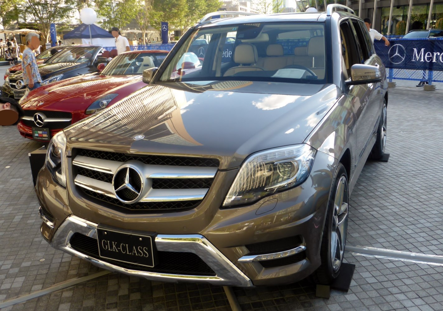 Front view of luxury SUV with LED headlights and prominent grille