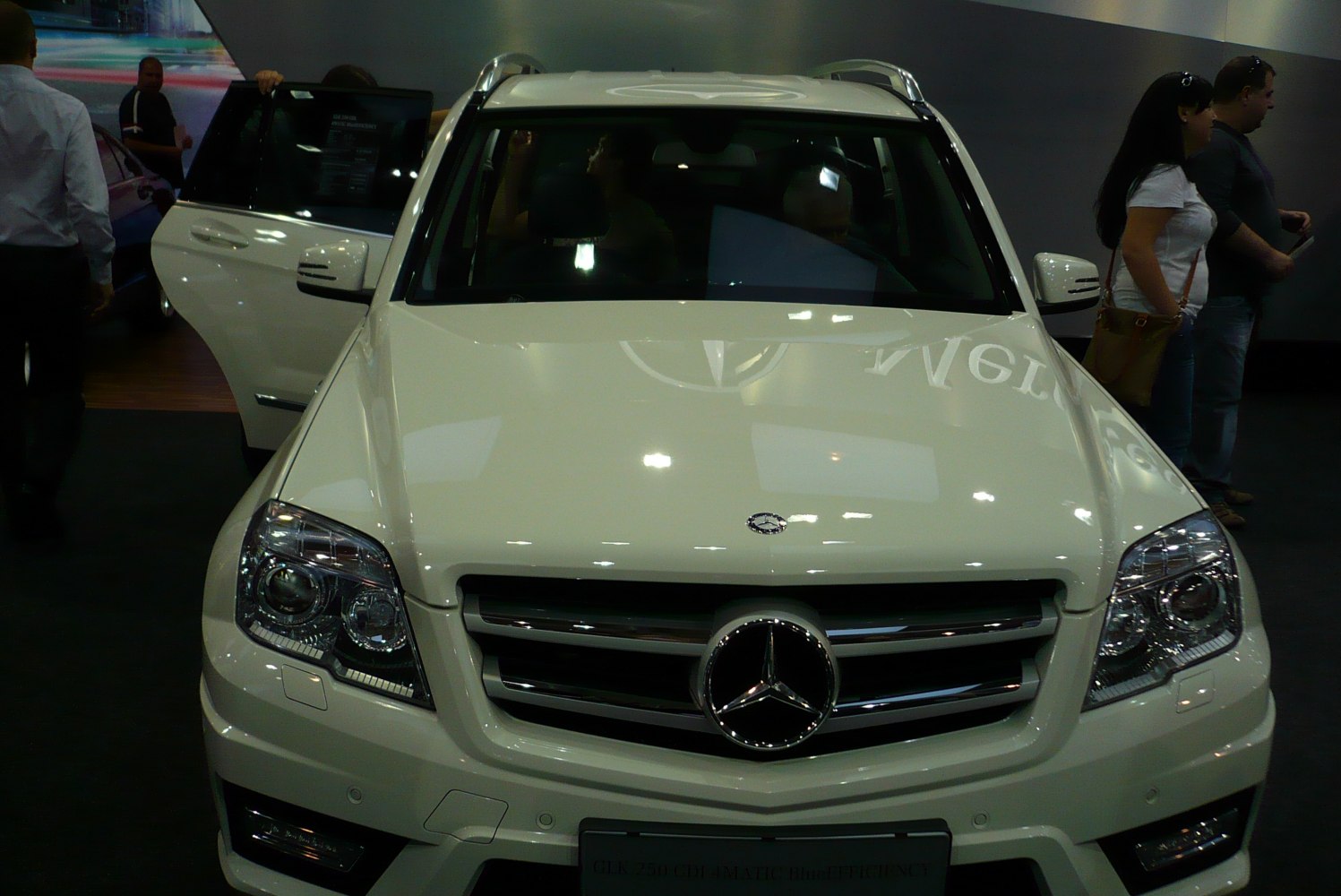 Front view with grille, headlights, and emblem of an SUV