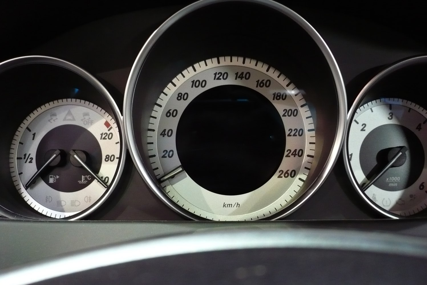 Instrument cluster with speedometer, tachometer, fuel and temperature gauges