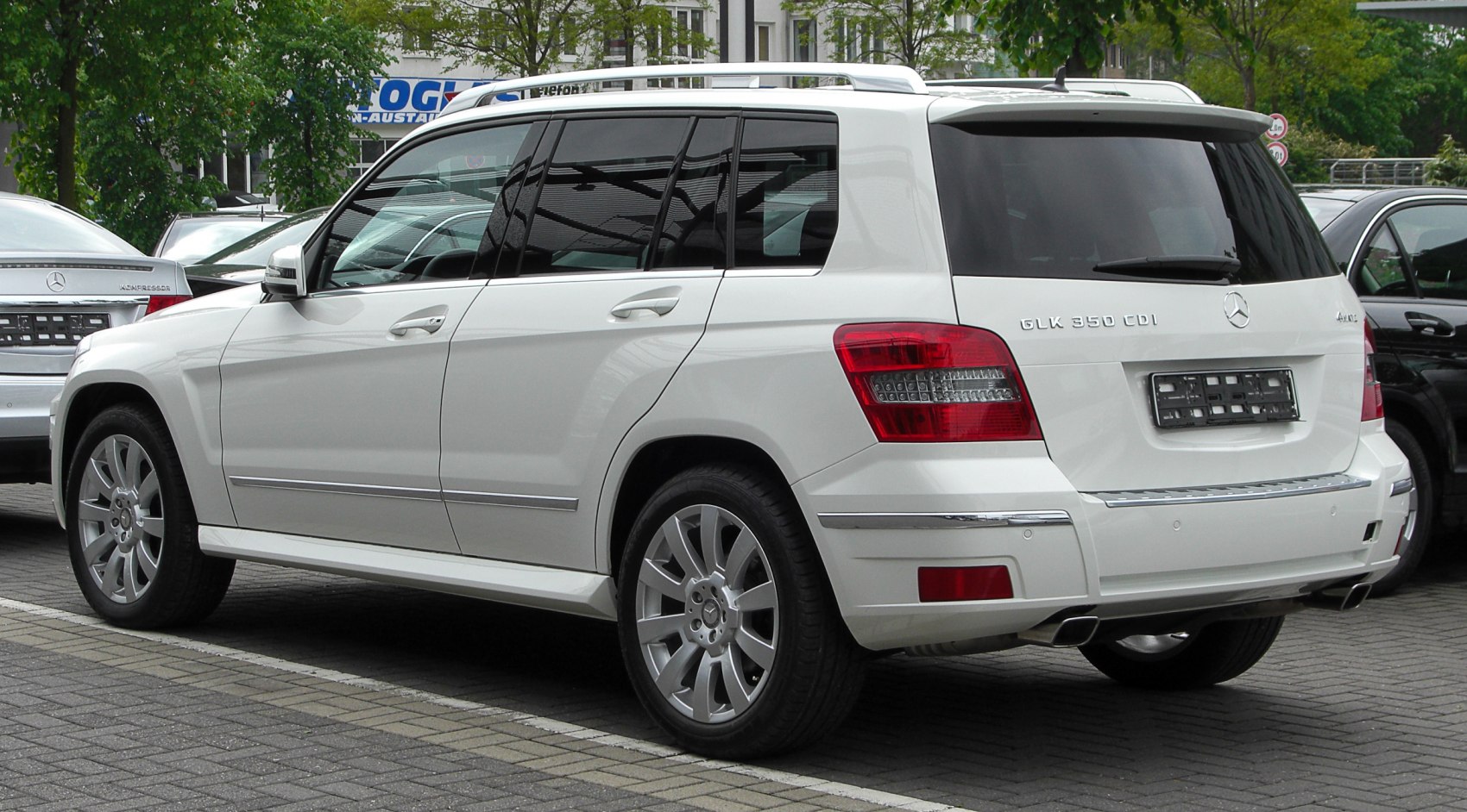 Rear side profile of an SUV with distinct taillights and tinted windows