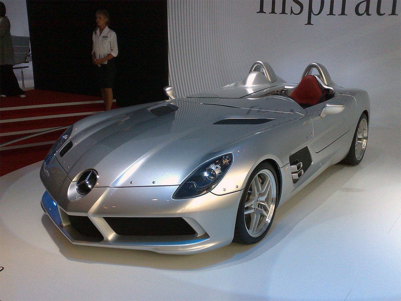 Front and cockpit view of sleek open-top roadster with aerodynamic lines