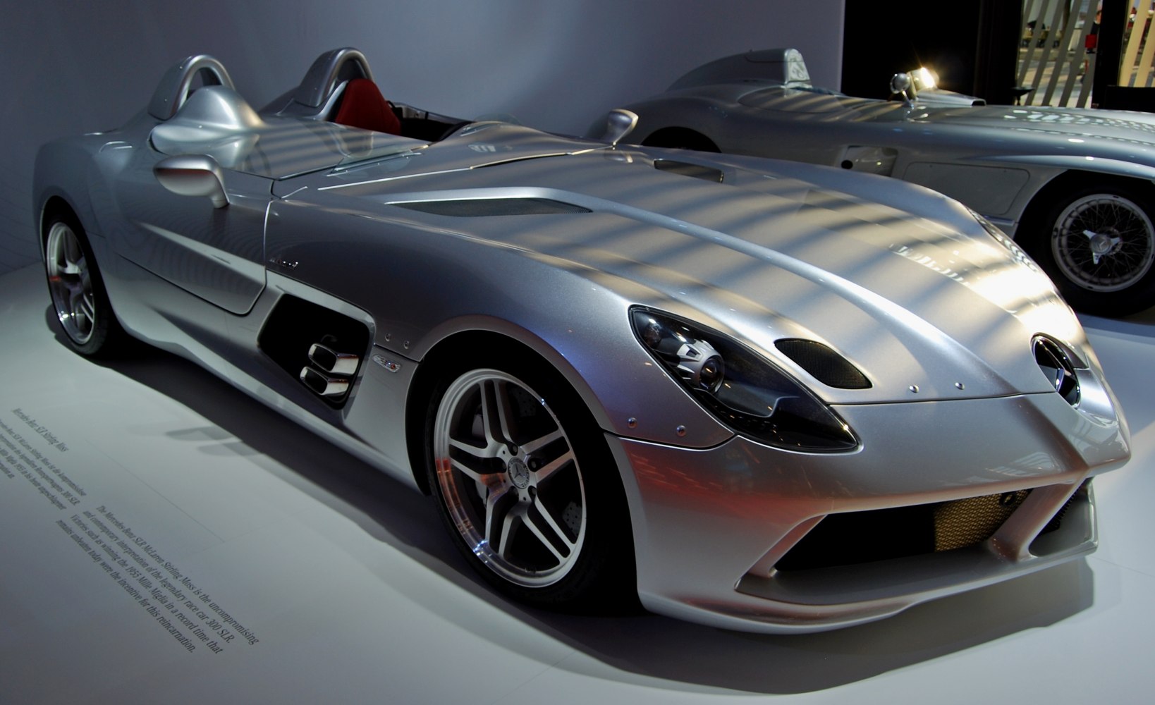 Silver open cockpit roadster with aerodynamic body and sporty wheels