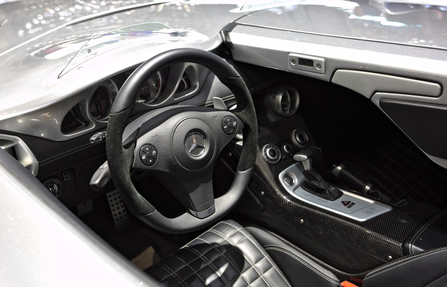 Luxury sports car interior with leather seats and carbon fiber center console