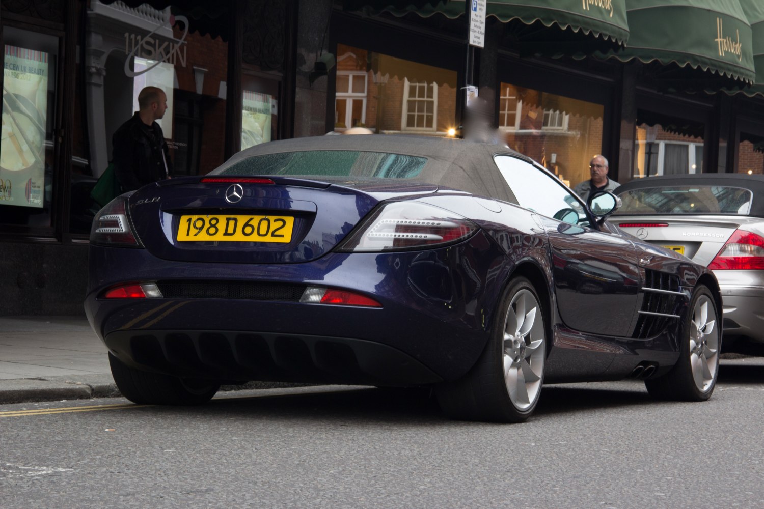 Rear view of convertible roadster with sleek taillights and dual exhaust