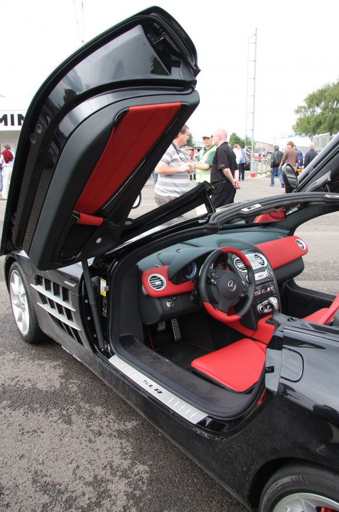 Butterfly door with red and black luxury sport interior.