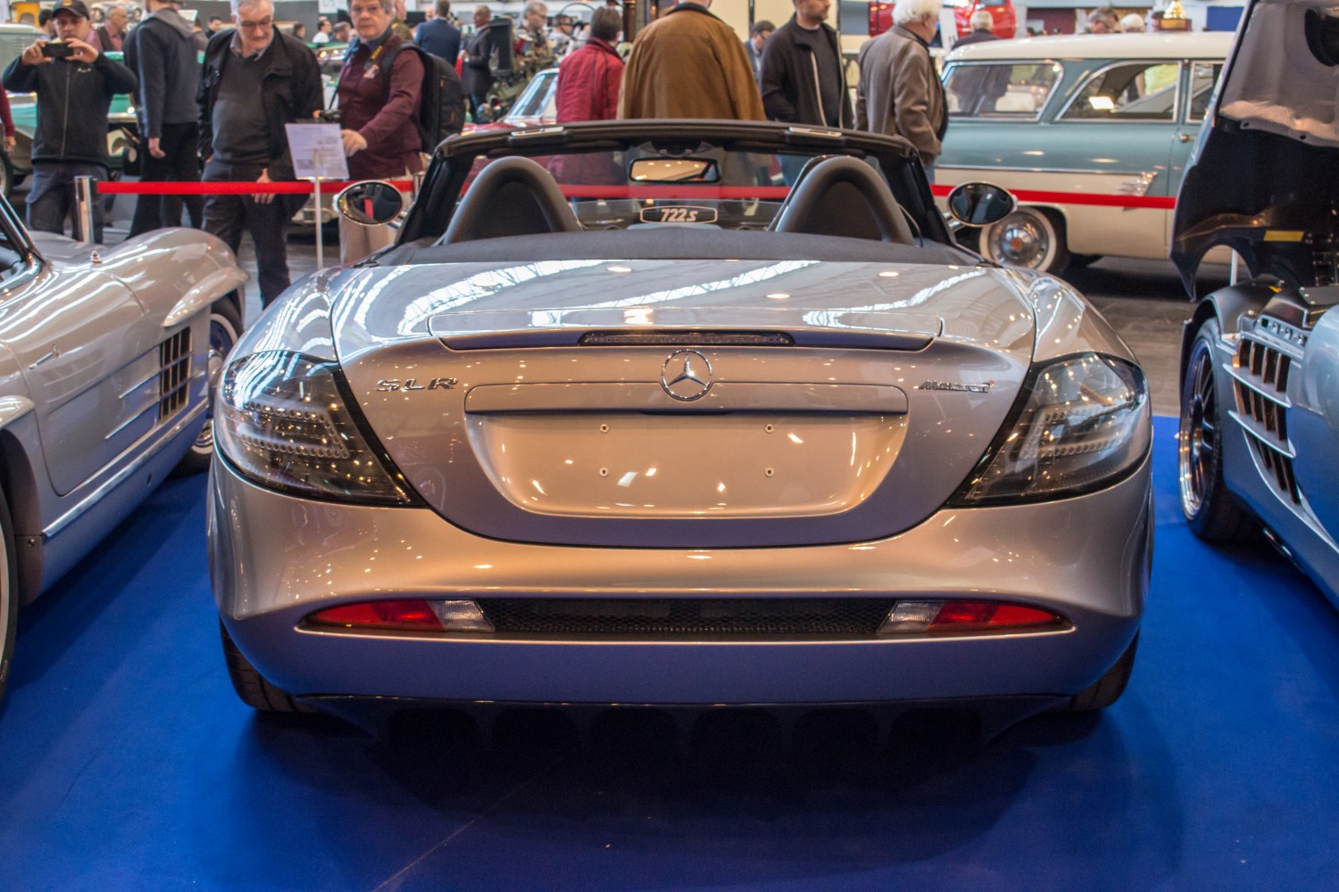 Rear view of a convertible with distinct taillights and smooth curves.