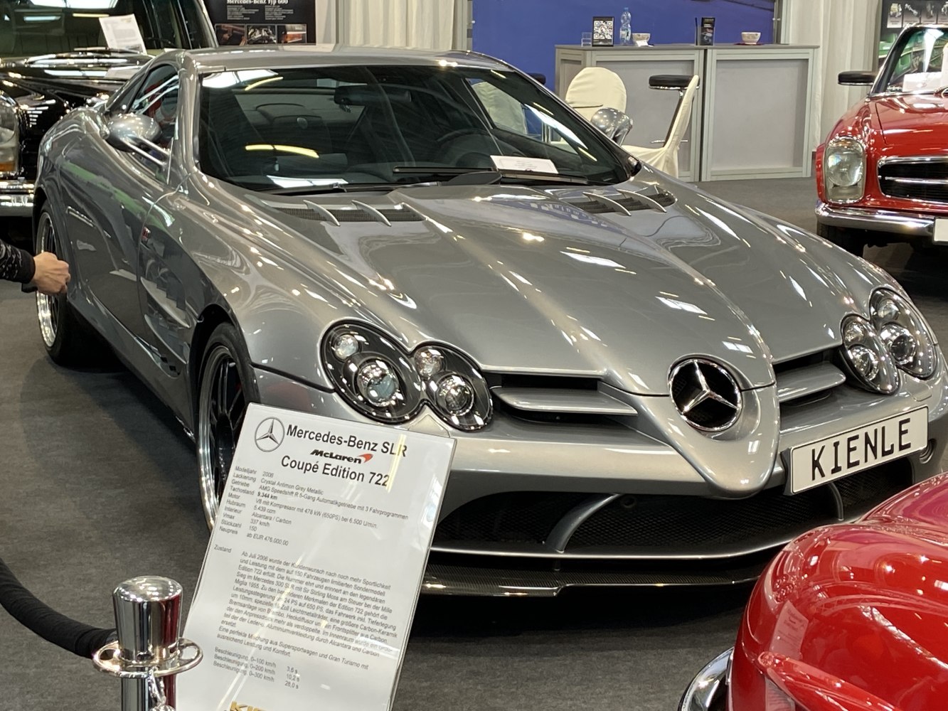 Silver coupe with distinctive front grille and quad round headlights